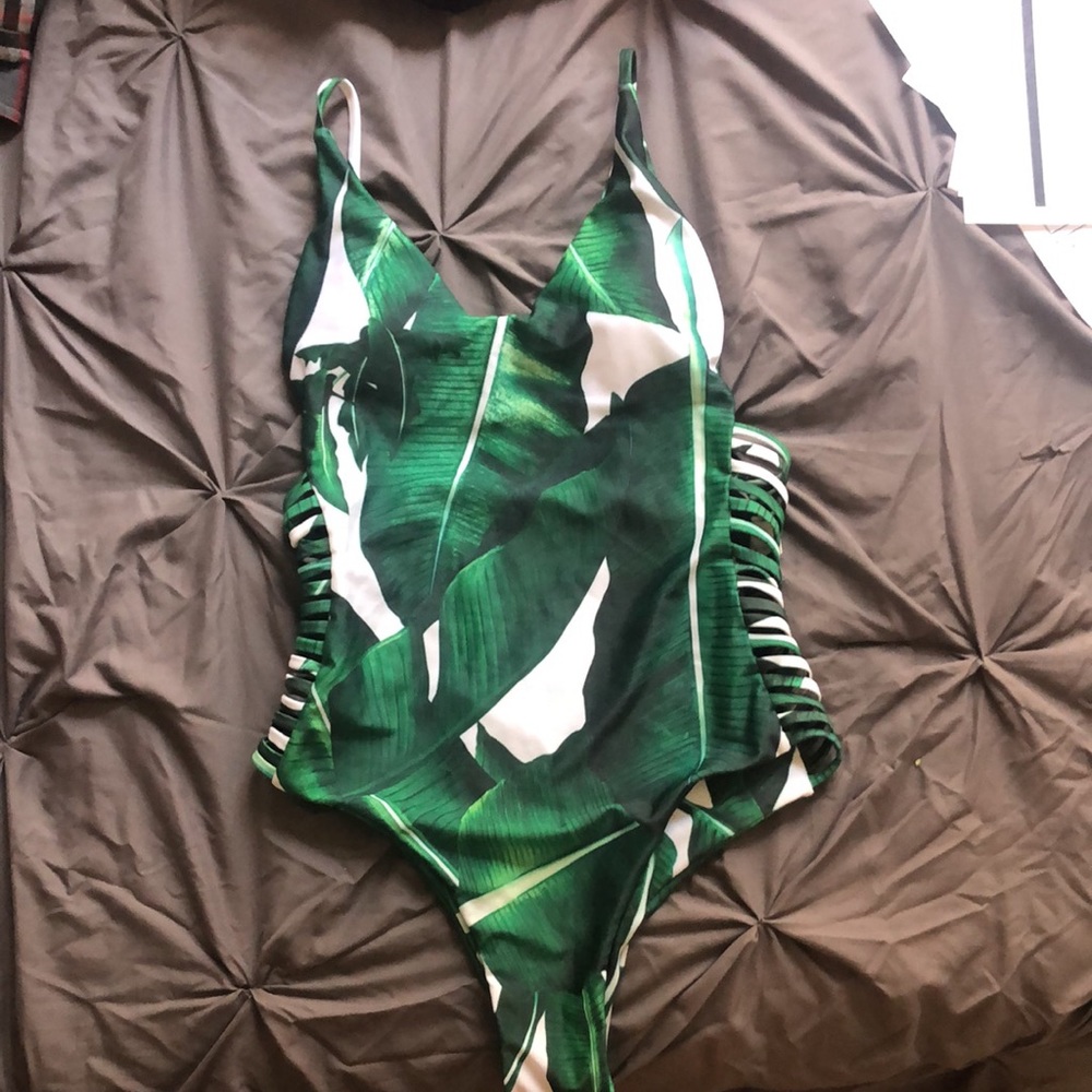 Green one piece swimsuit with low cut back
